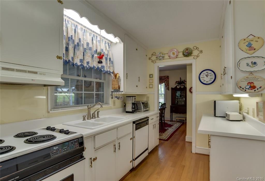 194 Harris Street Rutherfordton, NC 28139 - Photo 6 of 24 a kitchen with a sink and stove