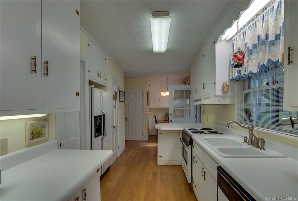 194 Harris Street Rutherfordton, NC 28139 - Photo 7 of 24 a kitchen with a sink stove and refrigerator
