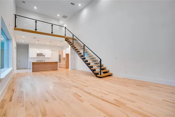 a view of an entryway with wooden floor
