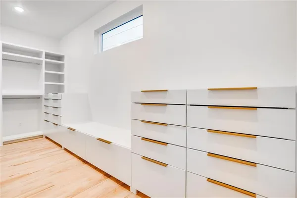 a view of closet area with empty racks