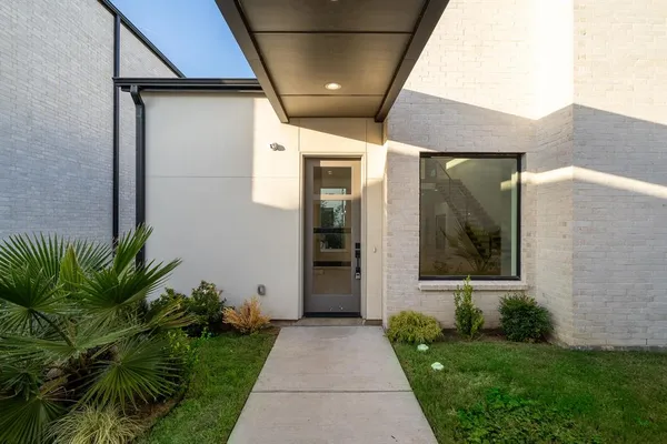 a path view of a house with a yard