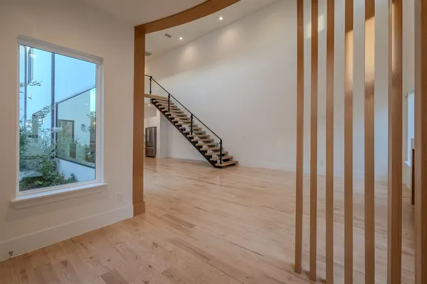 a view of an entryway with wooden floor