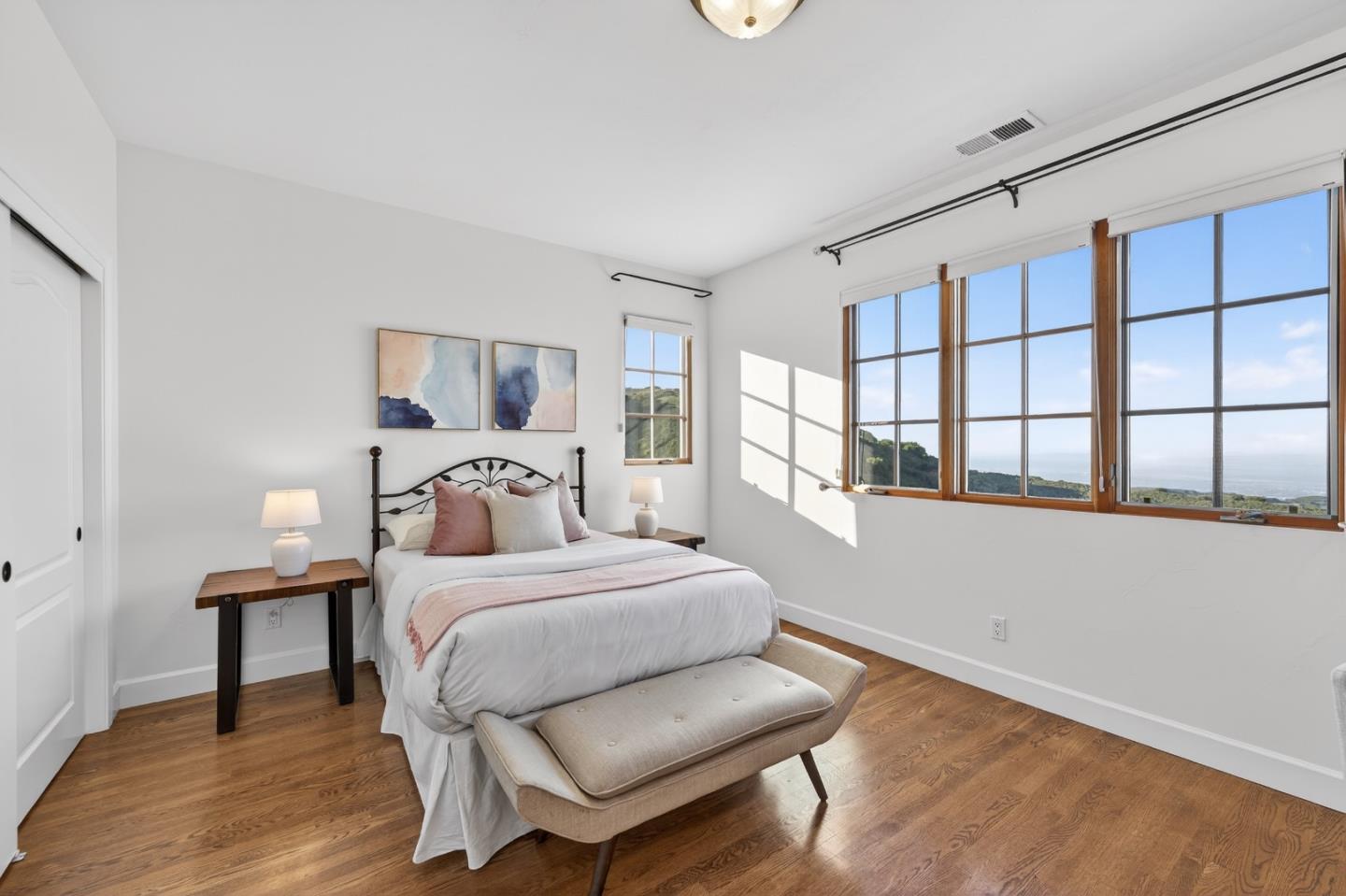 17599 Montebello Road Cupertino, CA 95014 - Photo 34 of 83 a bedroom with a bed and a large window