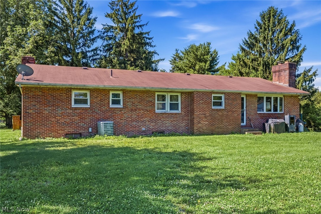 6890 Refugee Road Pickerington, OH 43147 - Photo 34 of 49 Brick exterior featuring a red roof and multiple windows