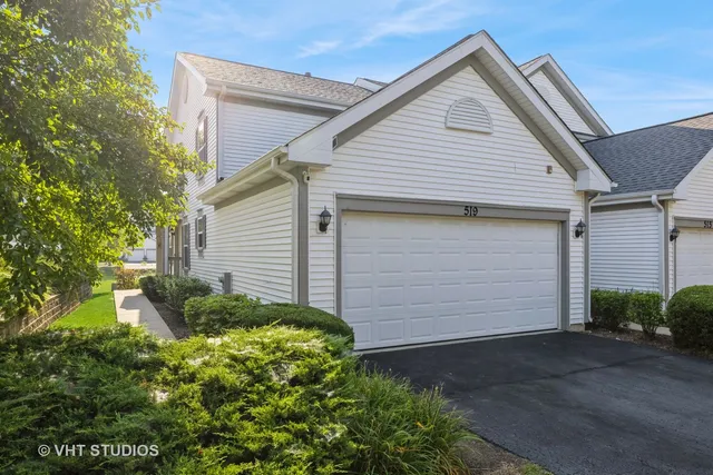 a front view of house along with garage
