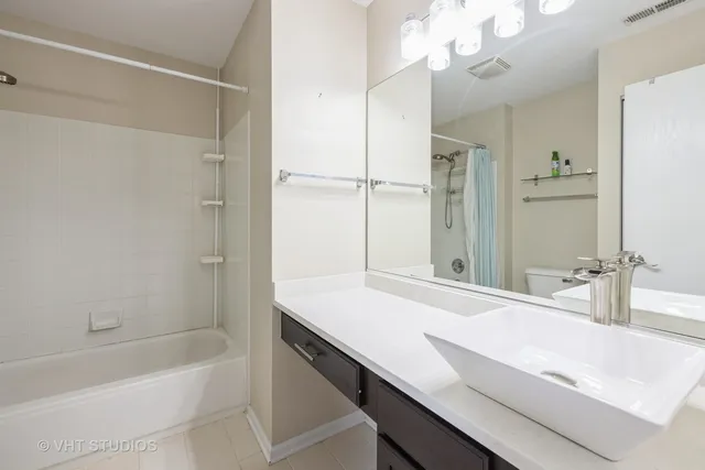 a bathroom with a sink a mirror and a bathtub