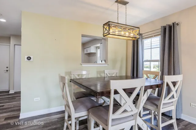 a view of a dining room with furniture and window