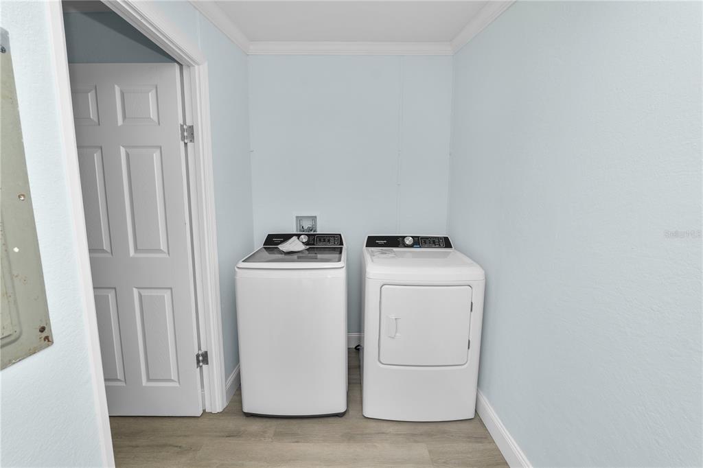 18805 St Paul Drive Spring Hill, FL 34610 - Photo 15 of 20 a utility room with dryer and washer