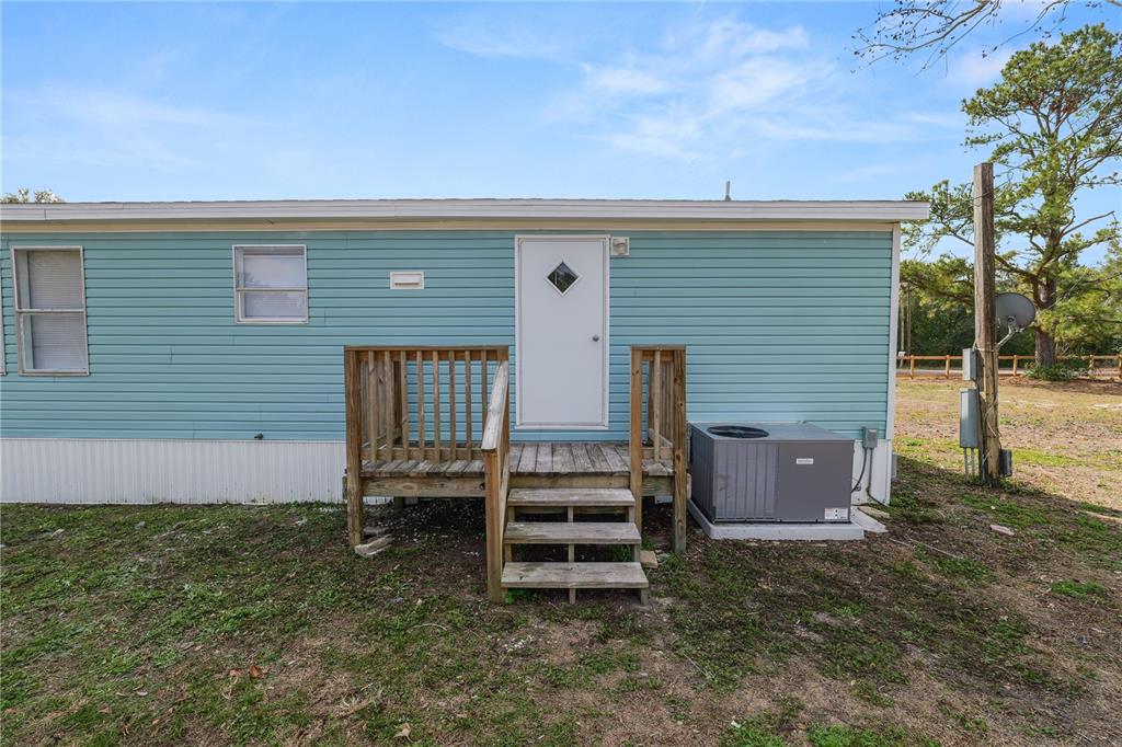 18805 St Paul Drive Spring Hill, FL 34610 - Photo 18 of 20 front view of a house with a yard