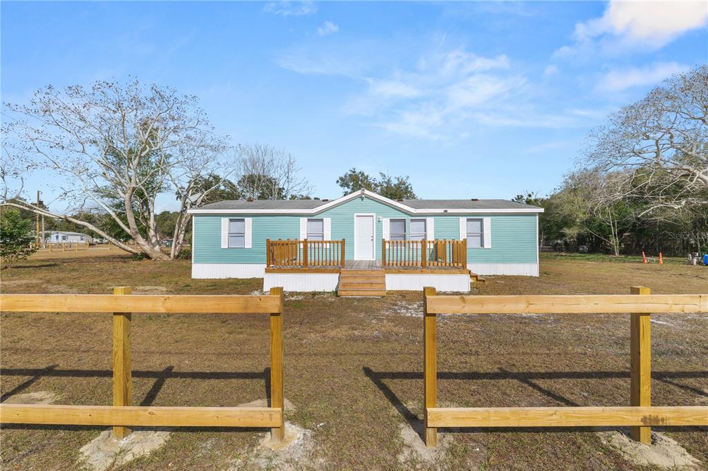 18805 St Paul Drive Spring Hill, FL 34610 - Photo 3 of 20 a front view of a house with a garden