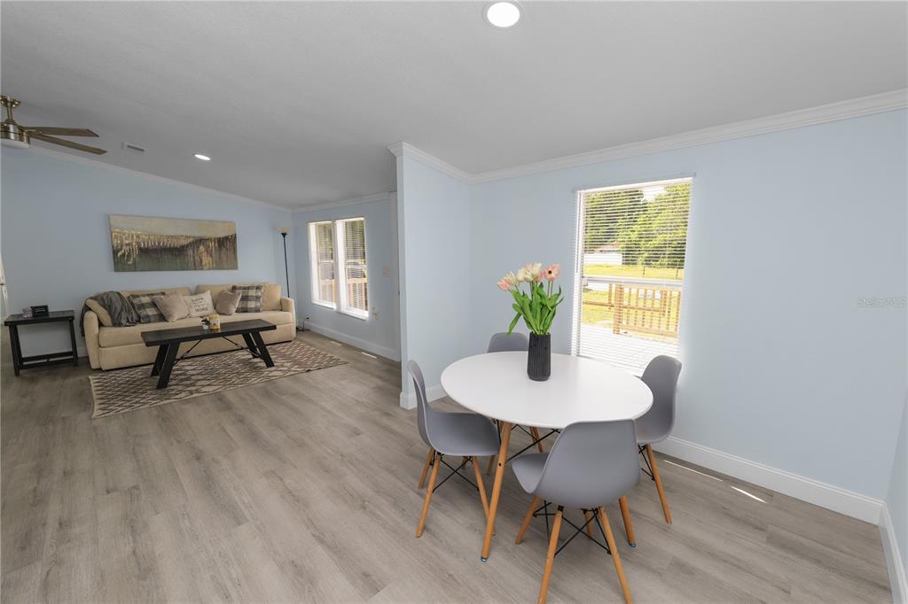 18805 St Paul Drive Spring Hill, FL 34610 - Photo 5 of 20 a workspace with furniture and a wooden floor