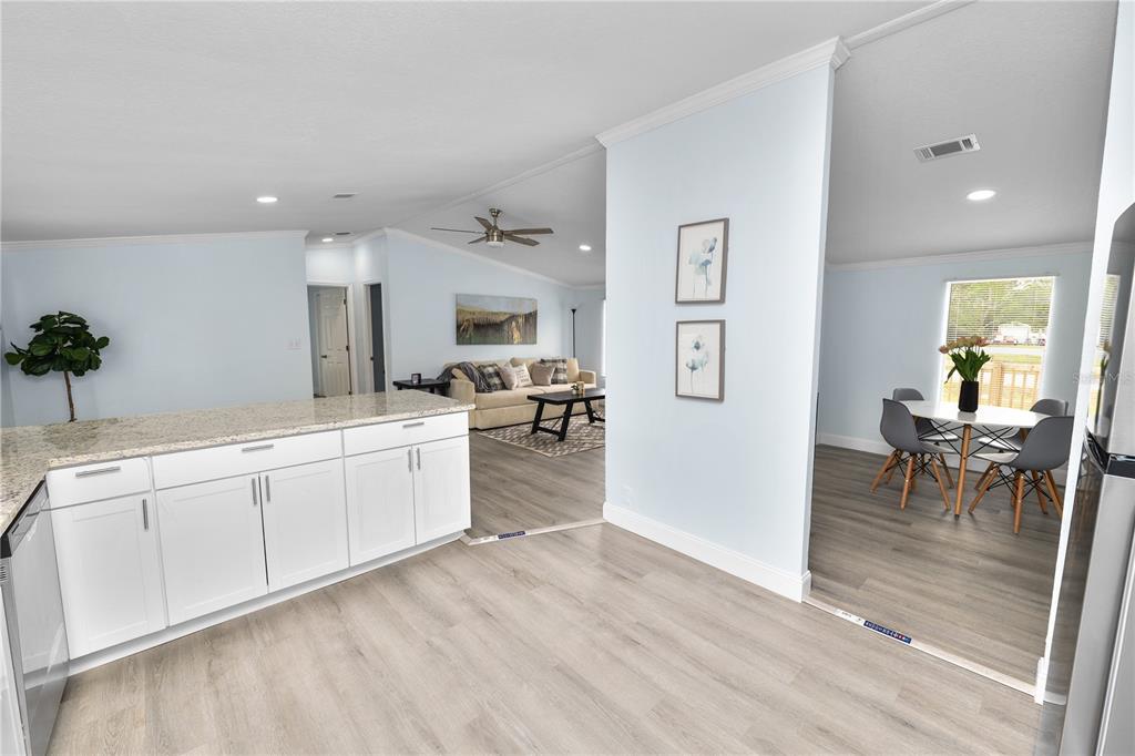 18805 St Paul Drive Spring Hill, FL 34610 - Photo 6 of 20 a large white kitchen with cabinets