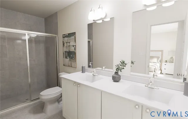 a bathroom with a double vanity sink toilet and shower