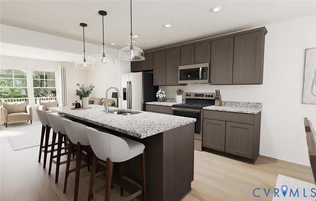 a kitchen with a table chairs microwave and cabinets
