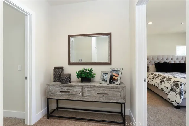 a bathroom with a double vanity sink a mirror and a bathtub