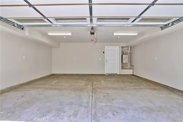 an outdoor space with patio and white umbrellas
