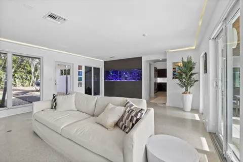 a large kitchen with stainless steel appliances granite countertop a sink and a stove