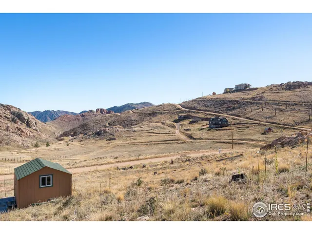 a view of a swimming pool with an outdoor seating