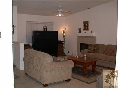68688 Durango Road Cathedral City, CA 92234 - Photo 3 of 14 a living room with furniture and a fireplace