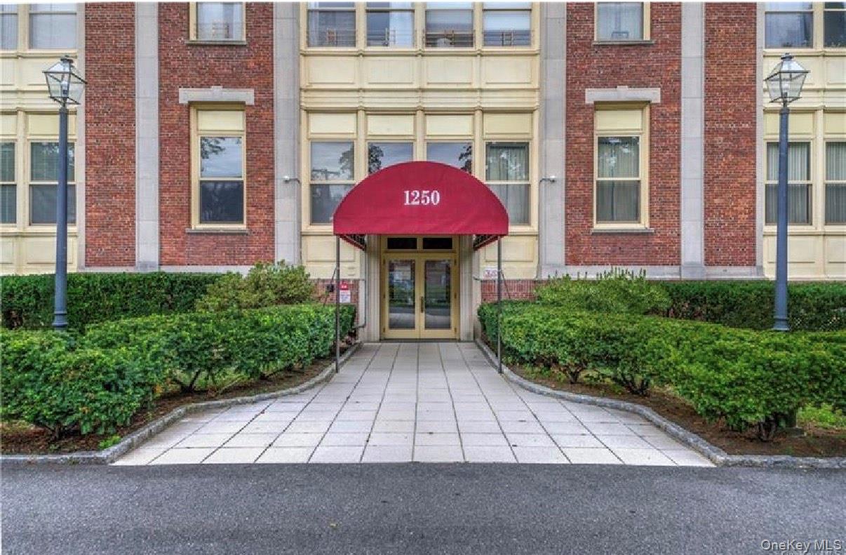 1250 North Avenue New Rochelle, NY 10804 - Photo 1 of 10 View of exterior entry with french doors and brick siding