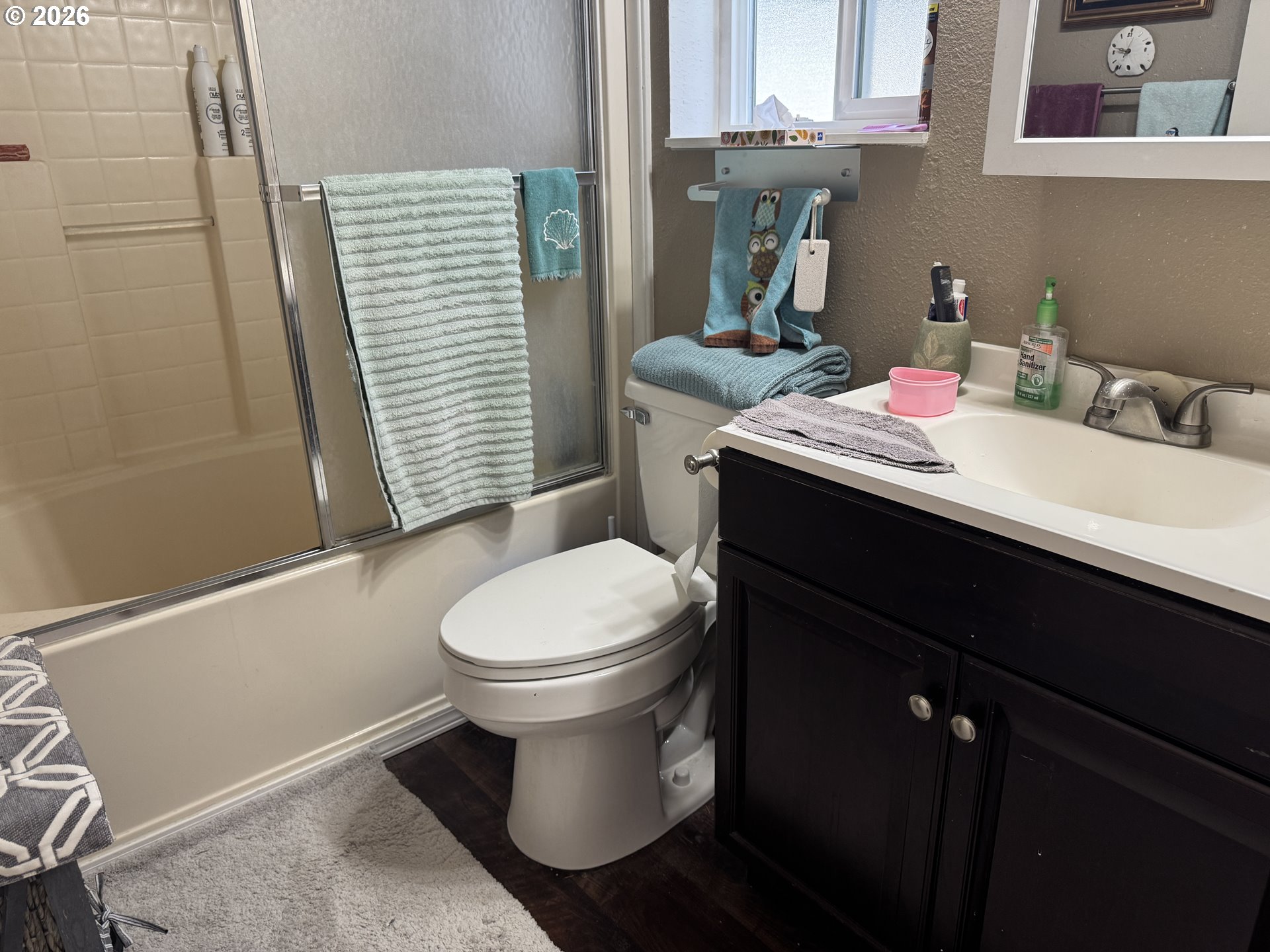 15619 Northeast Caples Road, Unit 44 Brush Prairie, WA 98606 - Photo 14 of 14 a bathroom with a sink toilet and window