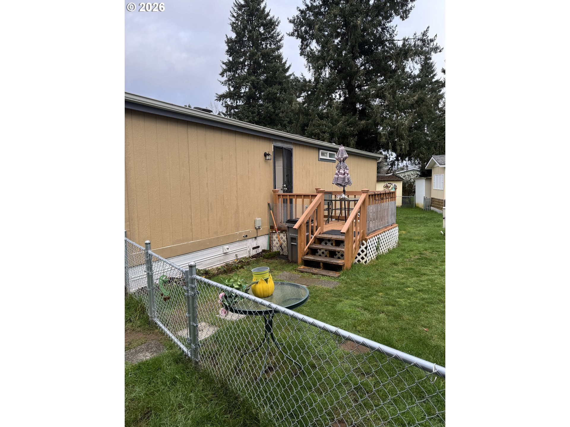 15619 Northeast Caples Road, Unit 44 Brush Prairie, WA 98606 - Photo 4 of 14 a backyard of a house with lots of green space