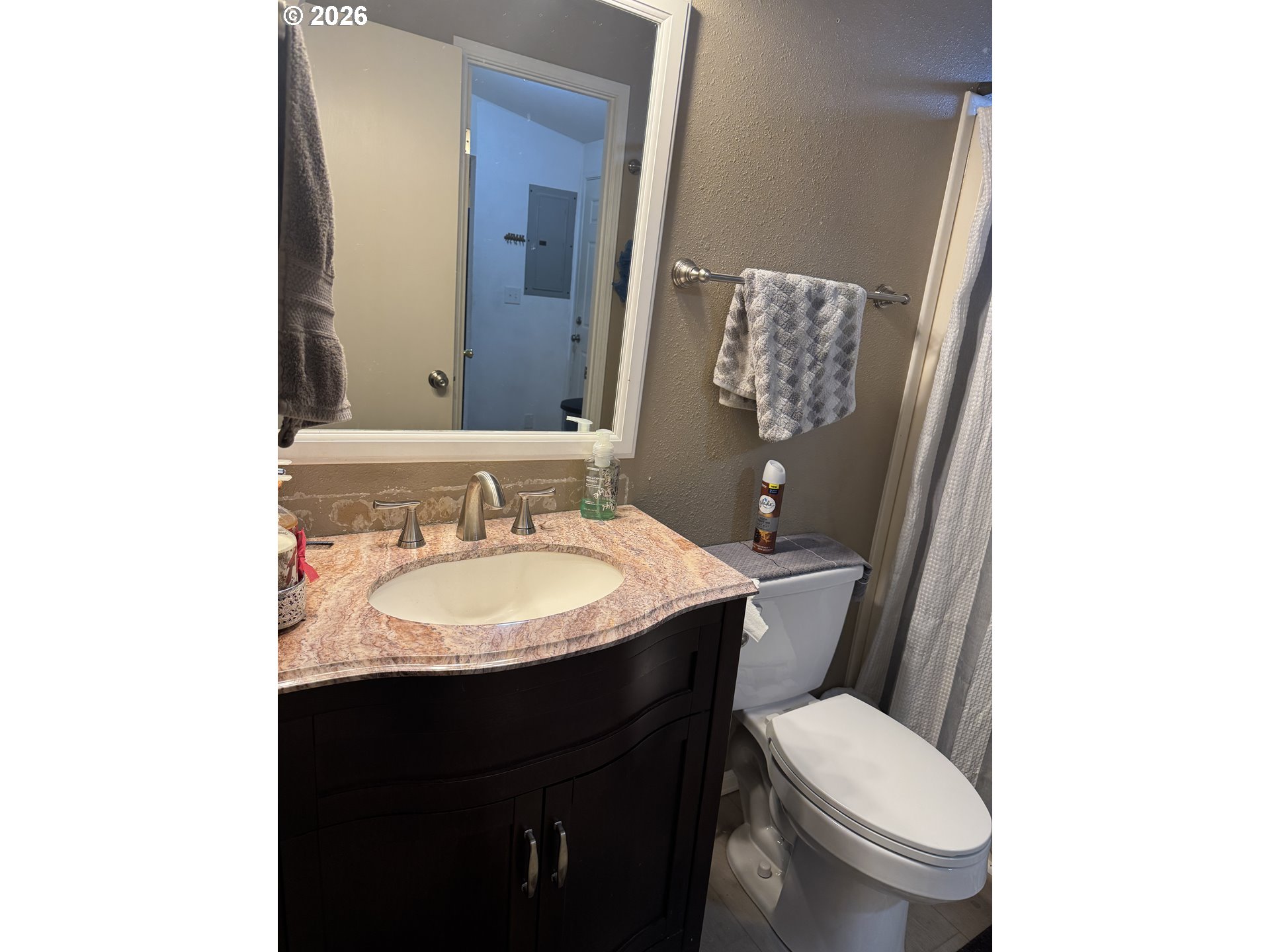 15619 Northeast Caples Road, Unit 44 Brush Prairie, WA 98606 - Photo 10 of 14 a bathroom with a sink and a toilet