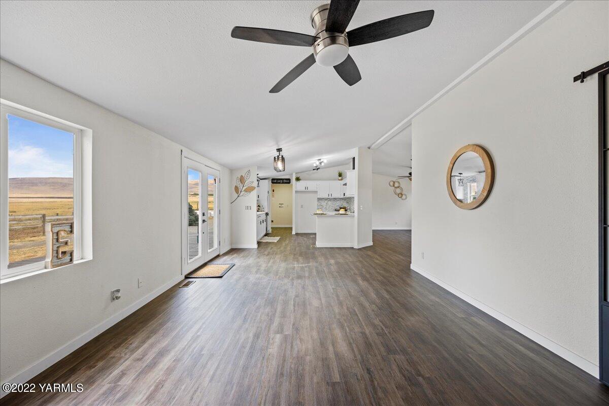 5701 Lateral 1 Road Wapato, WA 98951 - Photo 8 of 36 a view of a room with wooden floor and a ceiling fan