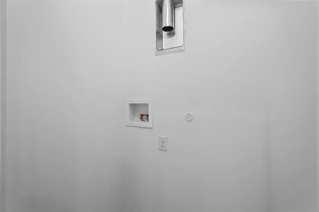 a view of a backyard with wooden fence