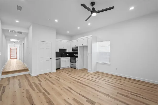 a view of kitchen with wooden floor and window