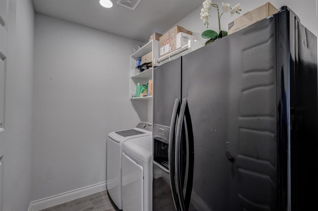 830 Knoxbridge Road Forney, TX 75126 - Photo 11 of 36 a view of storage and utility room with washer and dryer