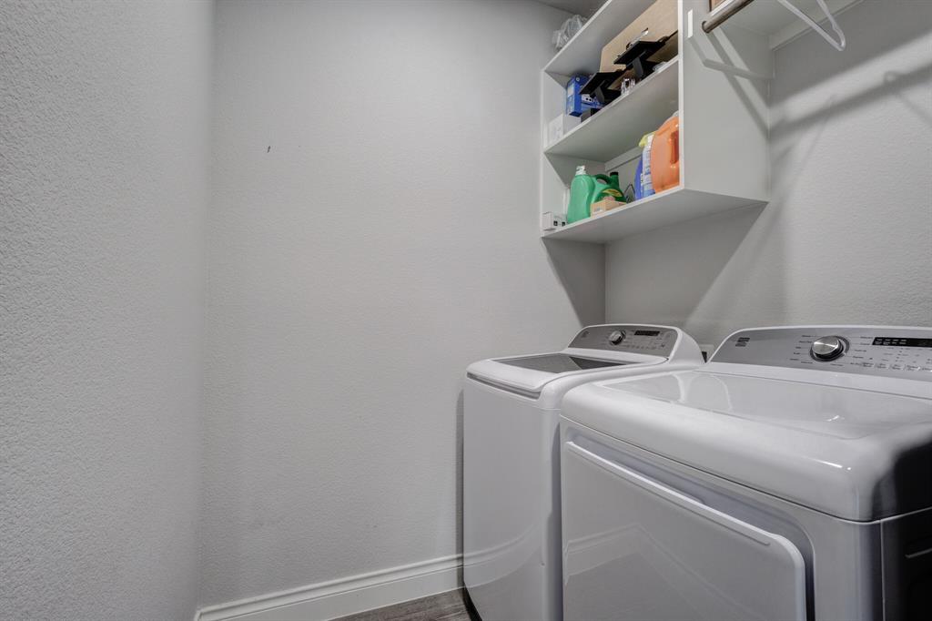 830 Knoxbridge Road Forney, TX 75126 - Photo 12 of 36 a utility room with dryer and washer