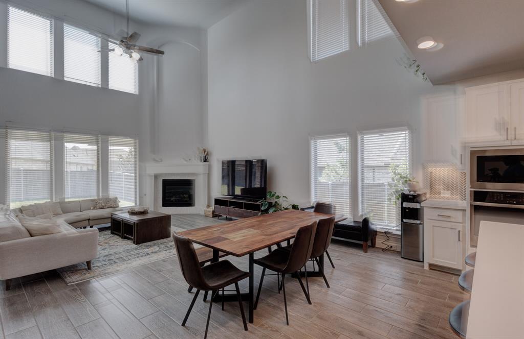 830 Knoxbridge Road Forney, TX 75126 - Photo 20 of 36 a view of a dining room with furniture window and wooden floor