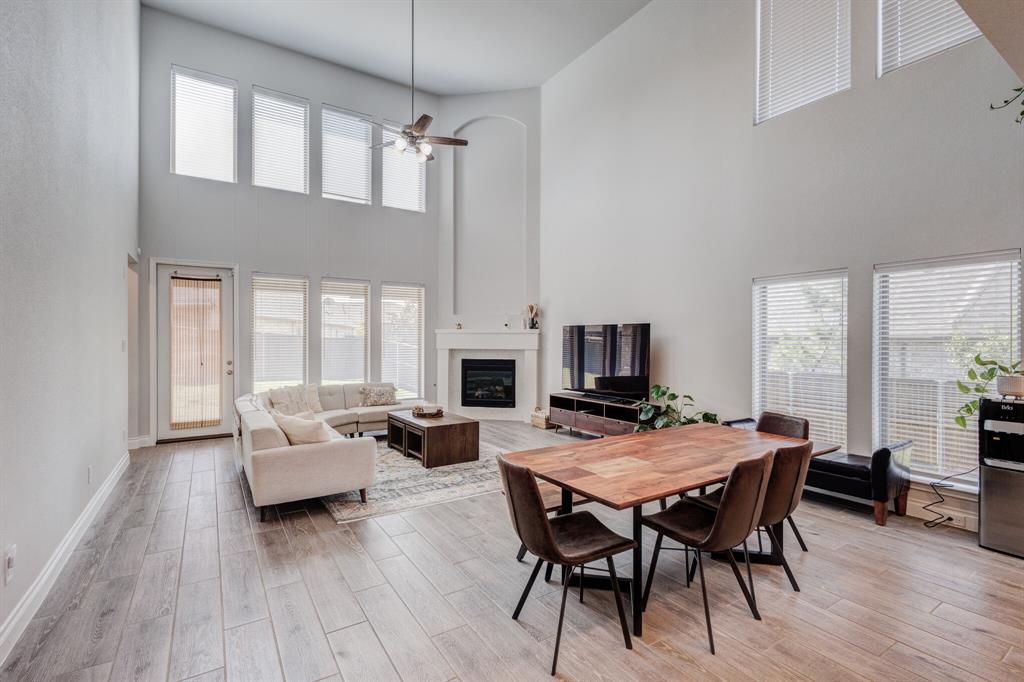 830 Knoxbridge Road Forney, TX 75126 - Photo 21 of 36 a view of a dining room with furniture window and wooden floor