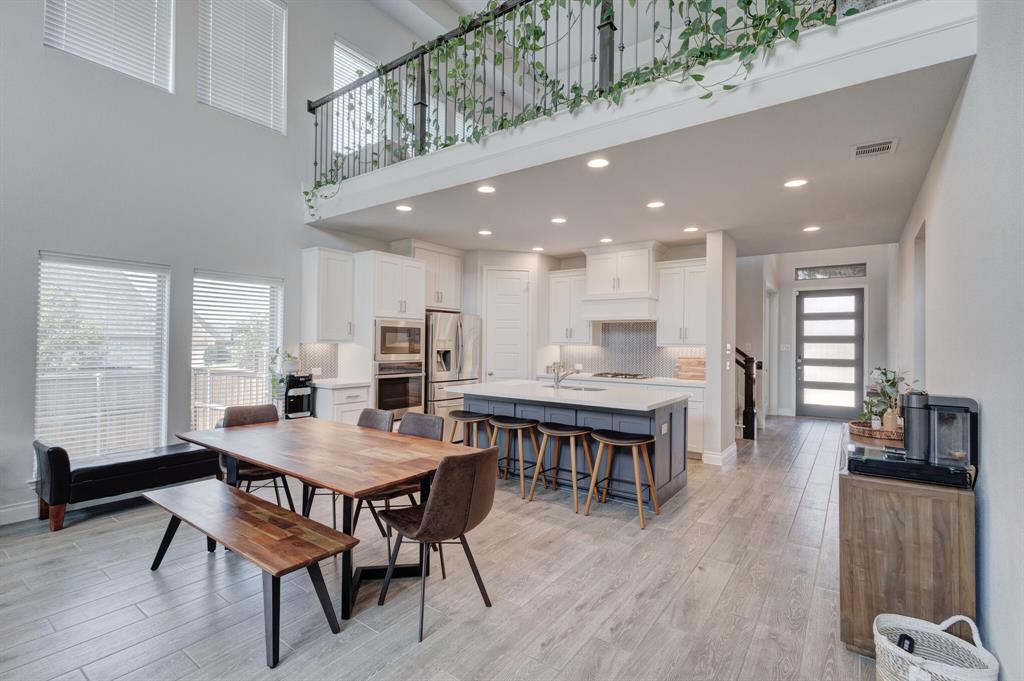 830 Knoxbridge Road Forney, TX 75126 - Photo 22 of 36 a dining room with furniture window and wooden floor