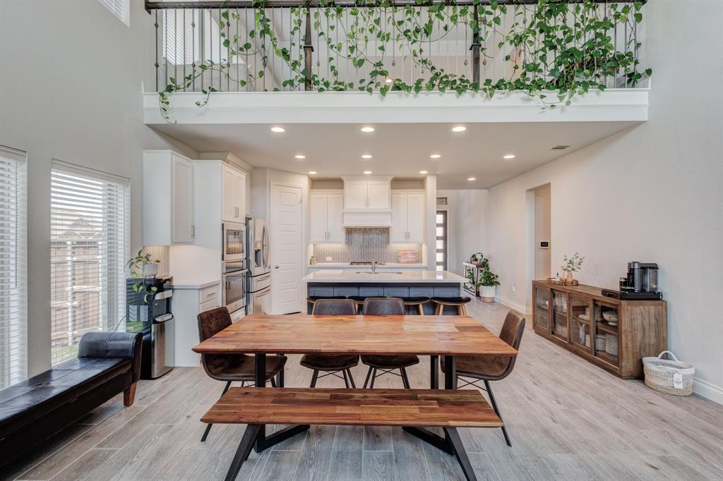 830 Knoxbridge Road Forney, TX 75126 - Photo 23 of 36 a view of a dining room with furniture window and wooden floor