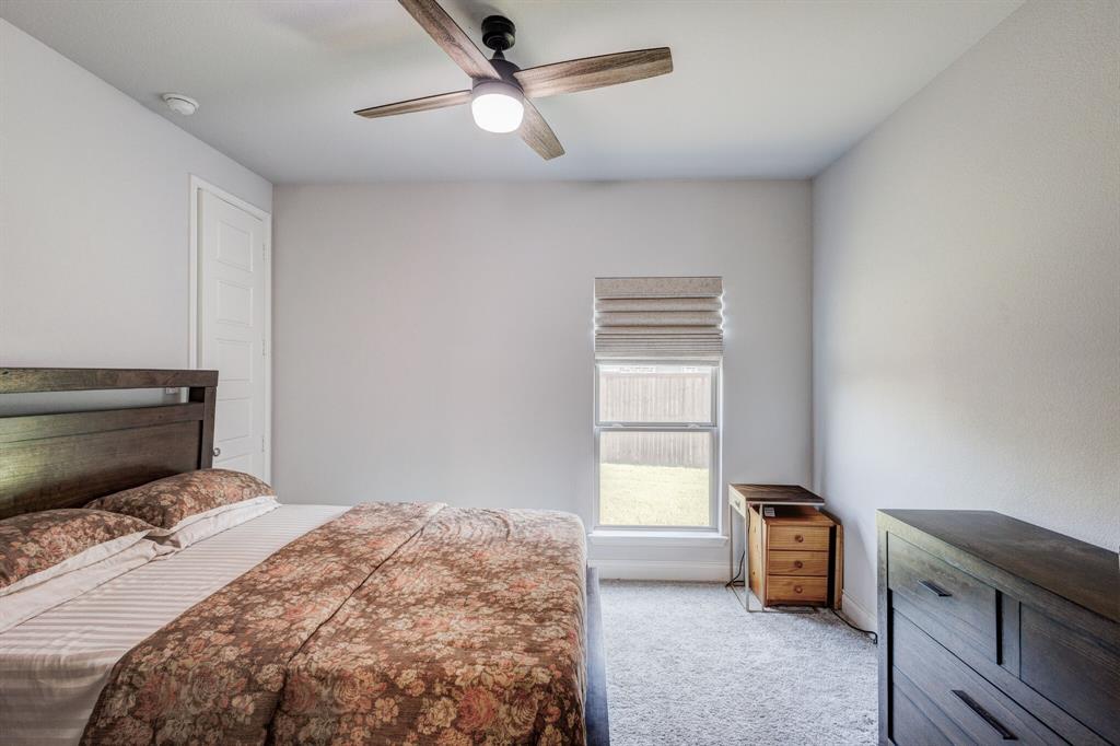 830 Knoxbridge Road Forney, TX 75126 - Photo 27 of 36 a bedroom with a bed and a window