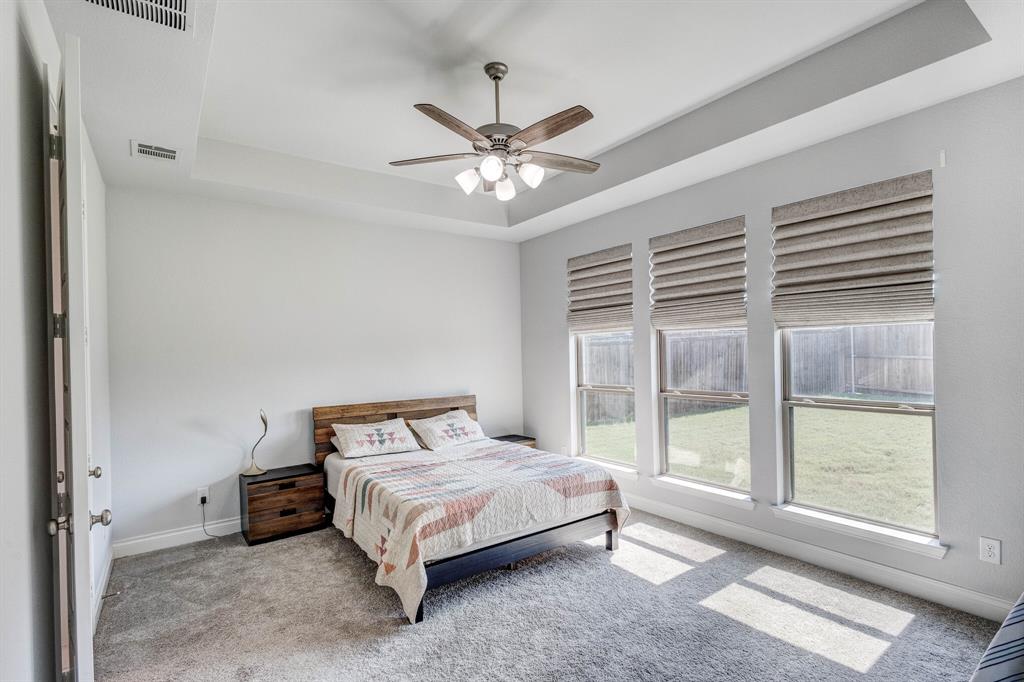 830 Knoxbridge Road Forney, TX 75126 - Photo 28 of 36 a bedroom with a bed and a large window