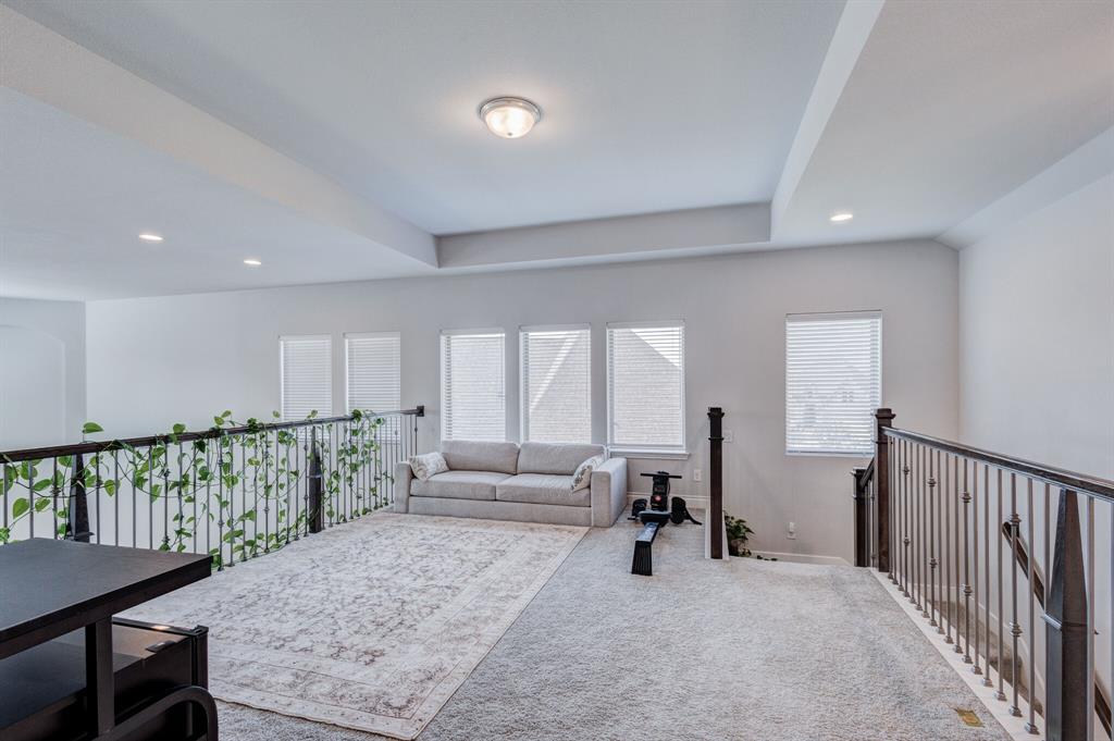 830 Knoxbridge Road Forney, TX 75126 - Photo 30 of 36 a living room with furniture and a wooden floor