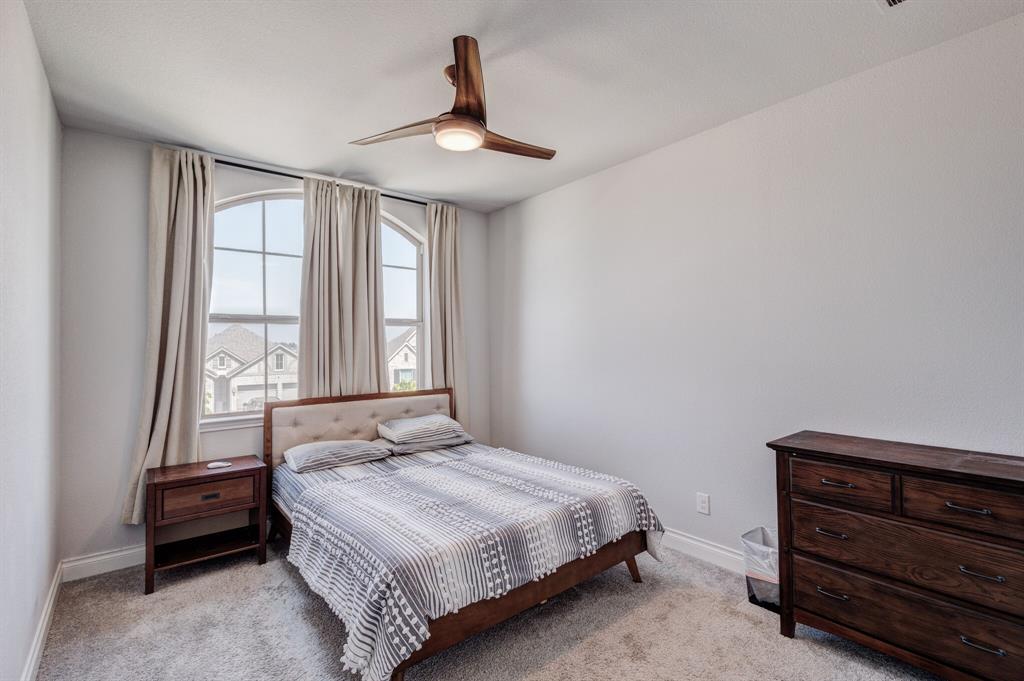 830 Knoxbridge Road Forney, TX 75126 - Photo 32 of 36 a bedroom with a bed and a window