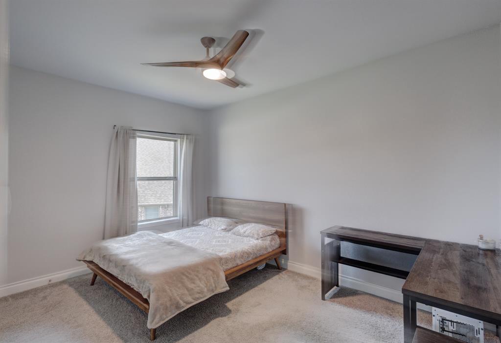 830 Knoxbridge Road Forney, TX 75126 - Photo 33 of 36 a bedroom with a bed and a dresser