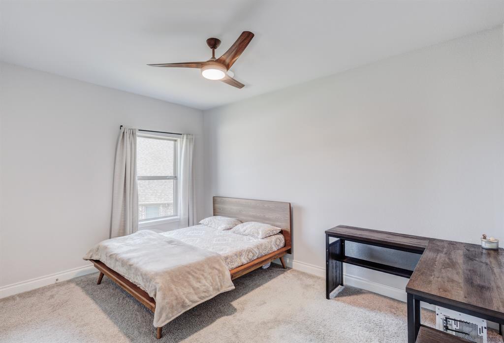 830 Knoxbridge Road Forney, TX 75126 - Photo 34 of 36 a bedroom with a bed and a dresser