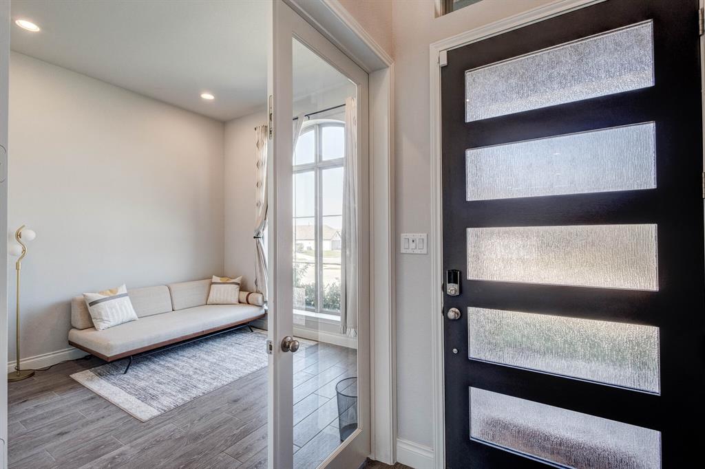 830 Knoxbridge Road Forney, TX 75126 - Photo 4 of 36 a living room with furniture and a window