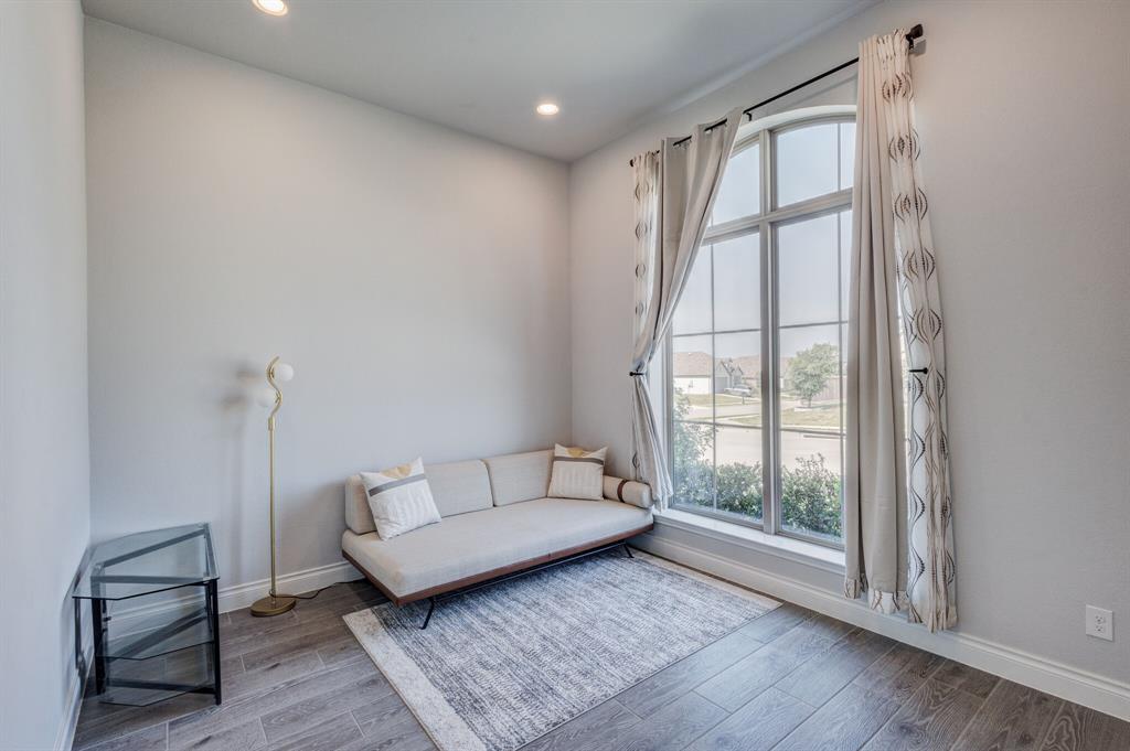 830 Knoxbridge Road Forney, TX 75126 - Photo 6 of 36 a spacious bedroom with a bed and a window