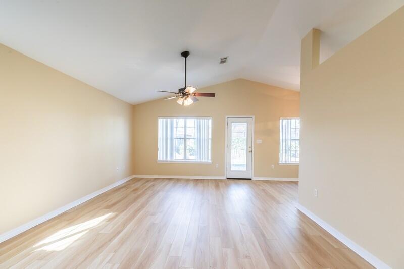 1607 Ella Ruth Drive Fort Walton Beach, FL 32547 - Photo 12 of 31 a view of an empty room with a window and wooden floor