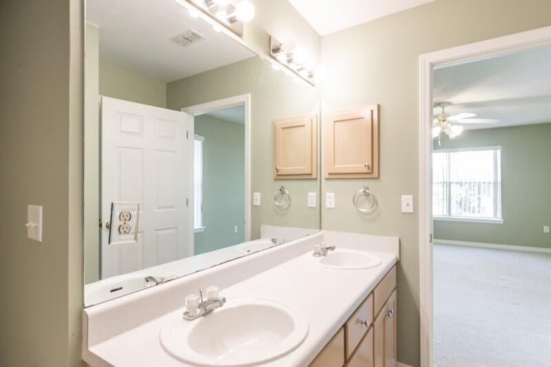 1607 Ella Ruth Drive Fort Walton Beach, FL 32547 - Photo 16 of 31 a bathroom with a sink and a mirror