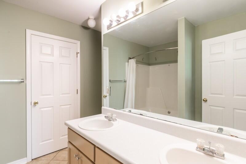 1607 Ella Ruth Drive Fort Walton Beach, FL 32547 - Photo 17 of 31 a bathroom with a sink and a mirror