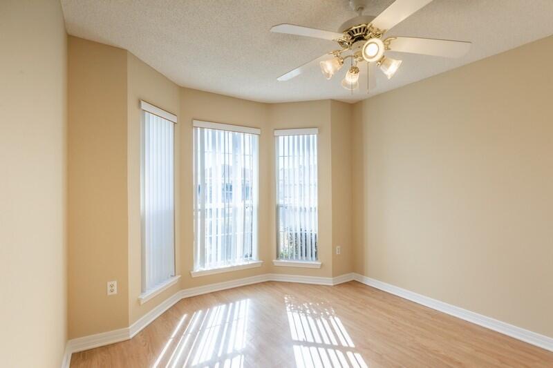 1607 Ella Ruth Drive Fort Walton Beach, FL 32547 - Photo 19 of 31 a view of an empty room with window and chandelier fan