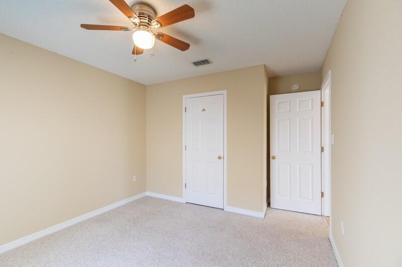 1607 Ella Ruth Drive Fort Walton Beach, FL 32547 - Photo 22 of 31 an empty room with closet and a chandelier fan
