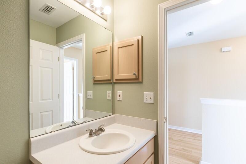 1607 Ella Ruth Drive Fort Walton Beach, FL 32547 - Photo 24 of 31 a bathroom with a sink and a mirror